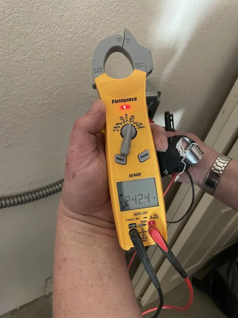 Voltage testing with clamp meter during Outlet Installation in Malvern